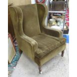 Upholstered wingback armchair Please Note - we do not make reference to the condition of lots within