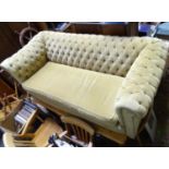 A two seater Chesterfield sofa with button back upholstery Please Note - we do not make reference to