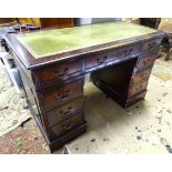 A mahogany pedestal desk with a green leather insert top Please Note - we do not make reference to