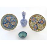 Three items of Turkish pottery, comprising a vase and cover and two chargers each decorated with