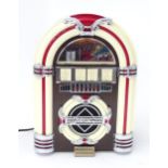 Novelty radio formed as a Juke box Please Note - we do not make reference to the condition of lots