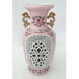 A large Oriental vase with reticular panels and flower detail. Approx. 19" high Please Note - we