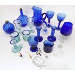 A quantity of assorted blue glass to include candlesticks, wine glasses, tumblers, etc. Please