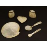 A quantity of mother of pearl items, to include salt and pepper pots, spoons, etc. (6) Please Note -
