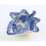 A Spode blue and white pickle dish of vine leaf form decorated with a landscape with Italian