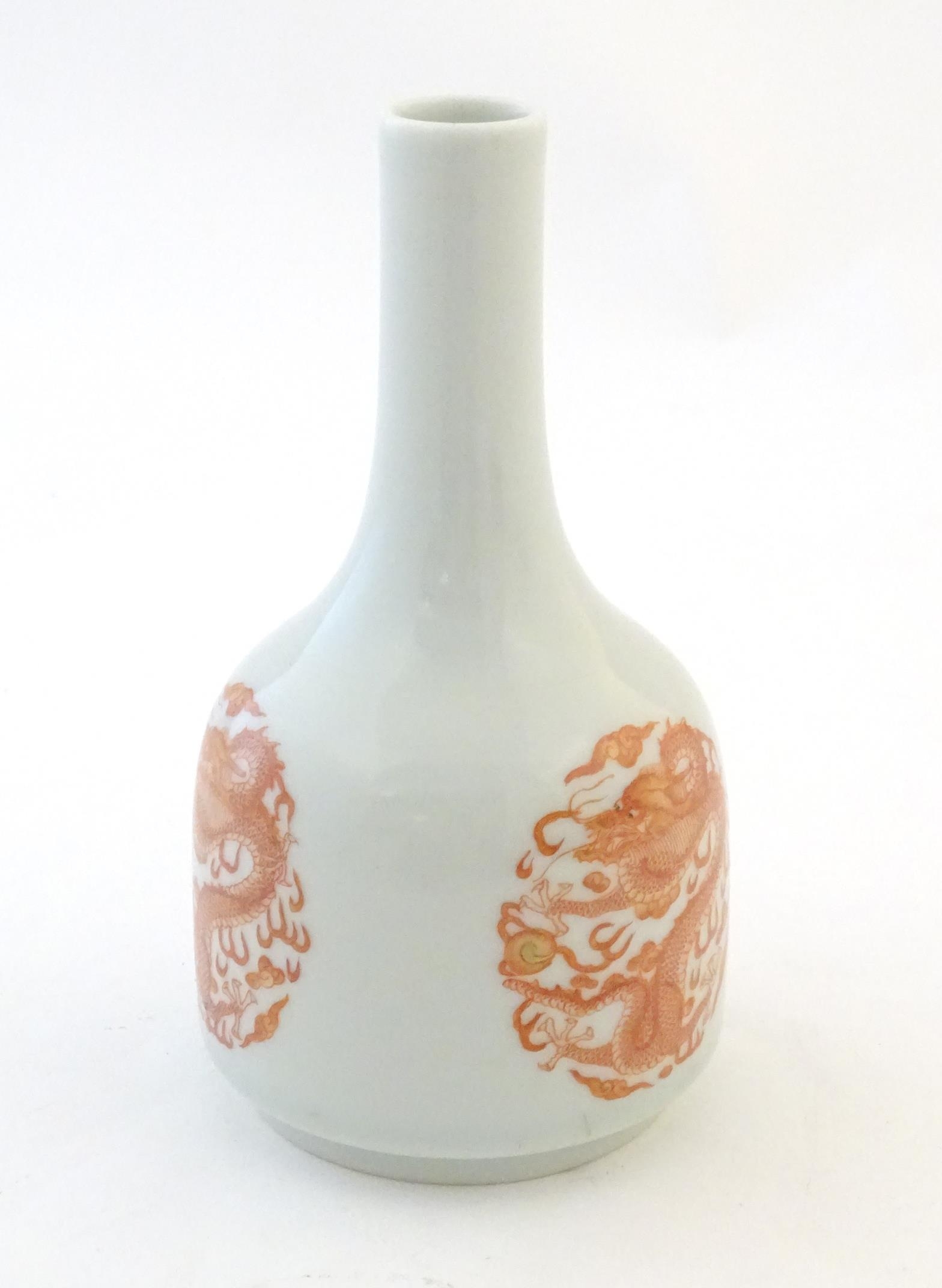 A Chinese bottle vase decorated with dragons and the flaming pearl amongst stylised clouds. - Image 3 of 6