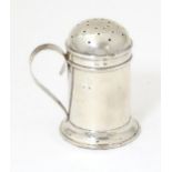 A silver pepperette formed as flour shaker, hallmarked Birmingham 1901, maker Thomas Ducrow. Approx.