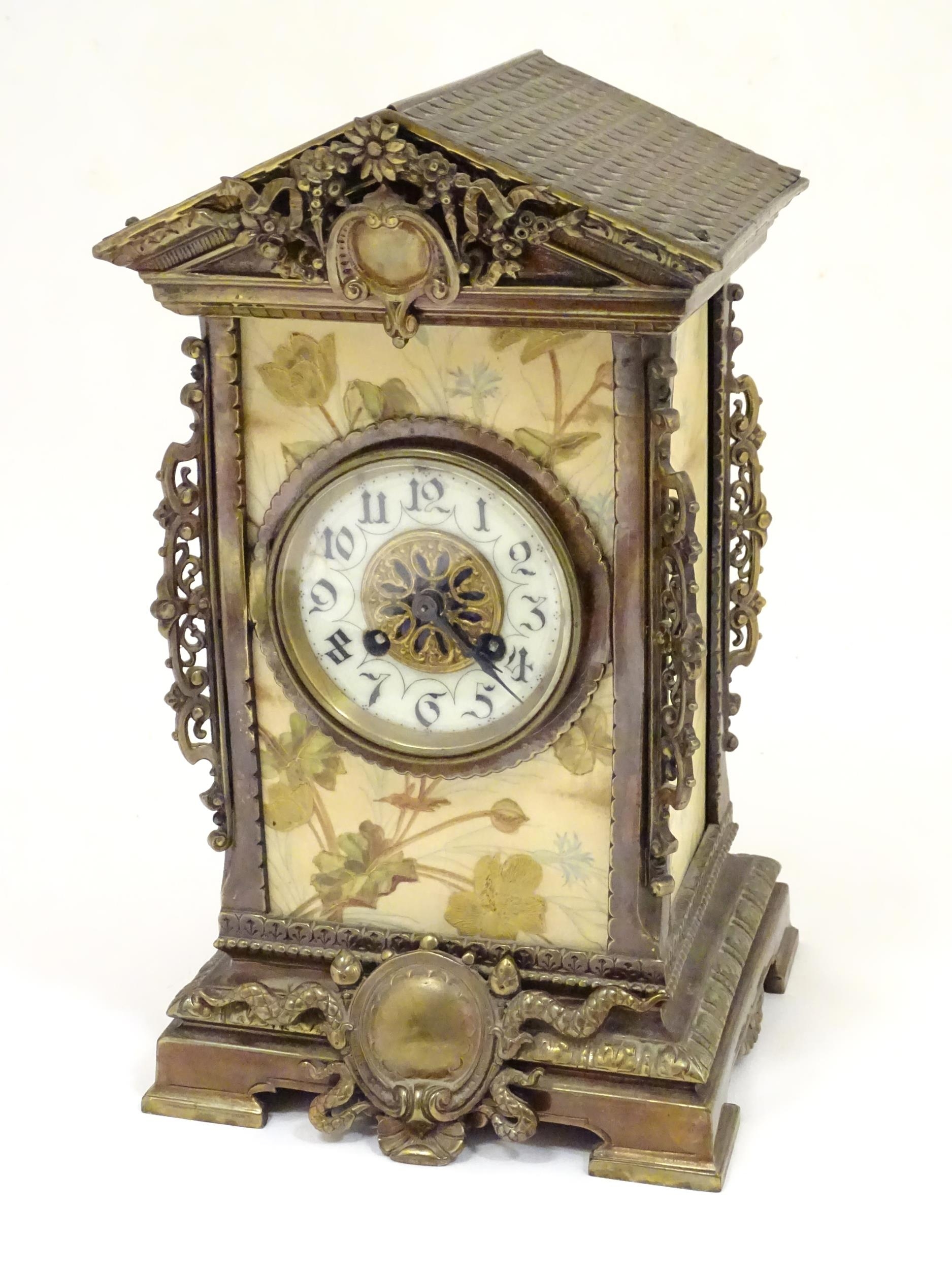 A 19thC brass and porcelain mantle clock, the 8-day French movement stamped F Marti Medaile De