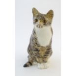A large Winstanley model of a seated cat. Marked under, size 7. Approx. 13 3/4" high Please Note -