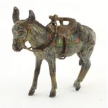 A cold painted bronze model of a donkey with saddle. Approx. 2" long Please Note - we do not make