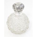 A Victorian cut glass scent / perfume bottle with silver top, hallmarked Birmingham 1899, maker A. &