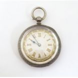 A Continental .800 silver cased pocket watch with engraved decoration. Approx. 1 1/2" diameter