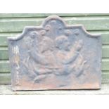 A 19thC continental cast iron fireback, decorated with opposing figures and with a raised border.