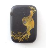 A Japanese vesta case with Komai style damascene decoration depicting a monkey in a tree and a