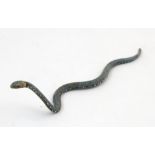 A cold painted bronze model of a snake. Approx. 3" long Please Note - we do not make reference to