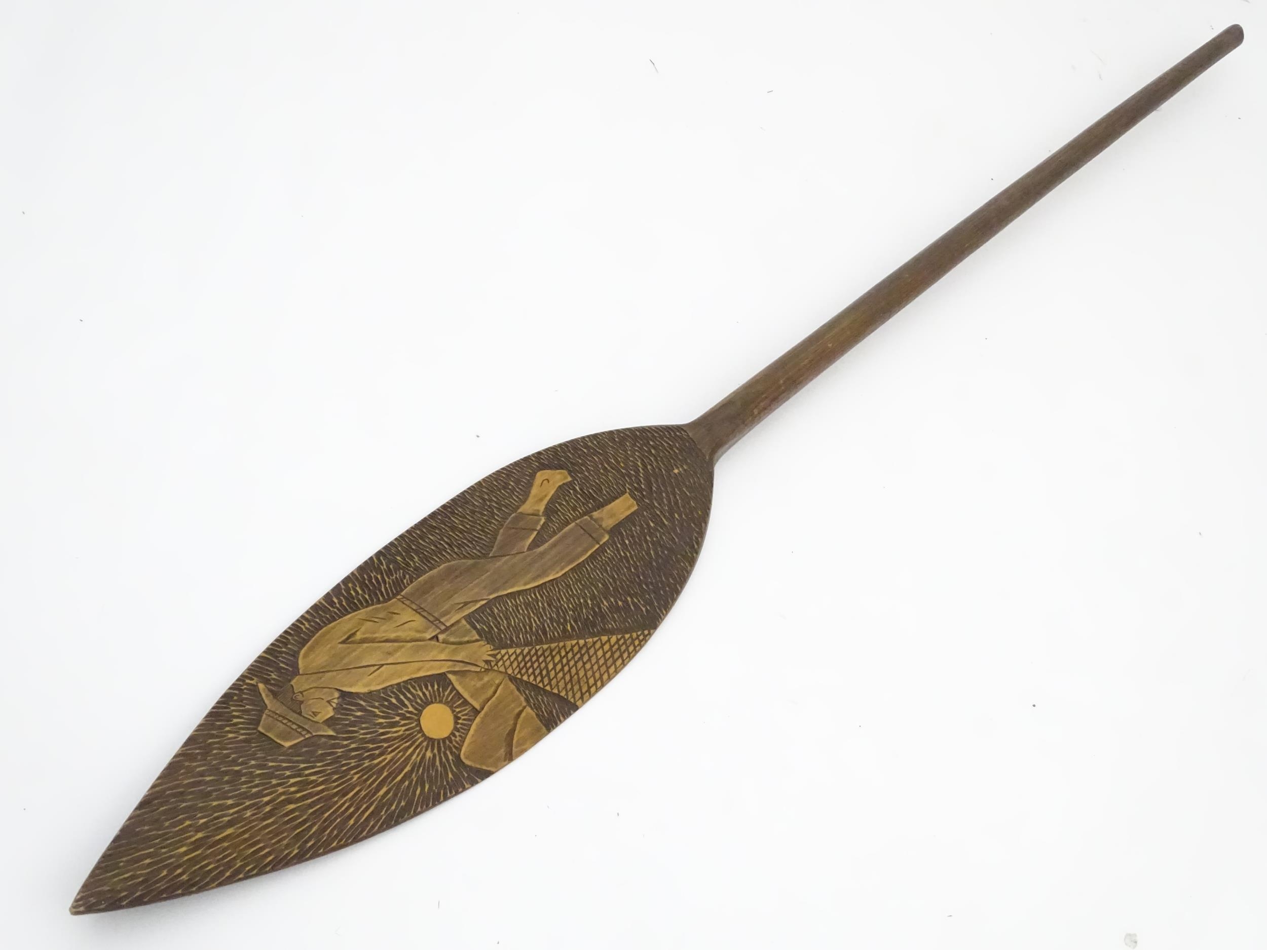 A Brazilian boat oar / paddle with carved decoration a man fishing with a net. Ascribed 'Itatiaia, - Image 3 of 8