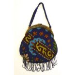 An early 20thC bead work bag / purse with stylised floral and foliate detail. Approx. 10" x 6 1/4"