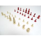 Toys: A 19thC / early 20thC set of turned and carved bone chess pieces, the largest approx. 4"