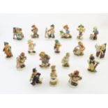 A quantity of Friedel figures to include an artist with palette and easel, a farm boy with a