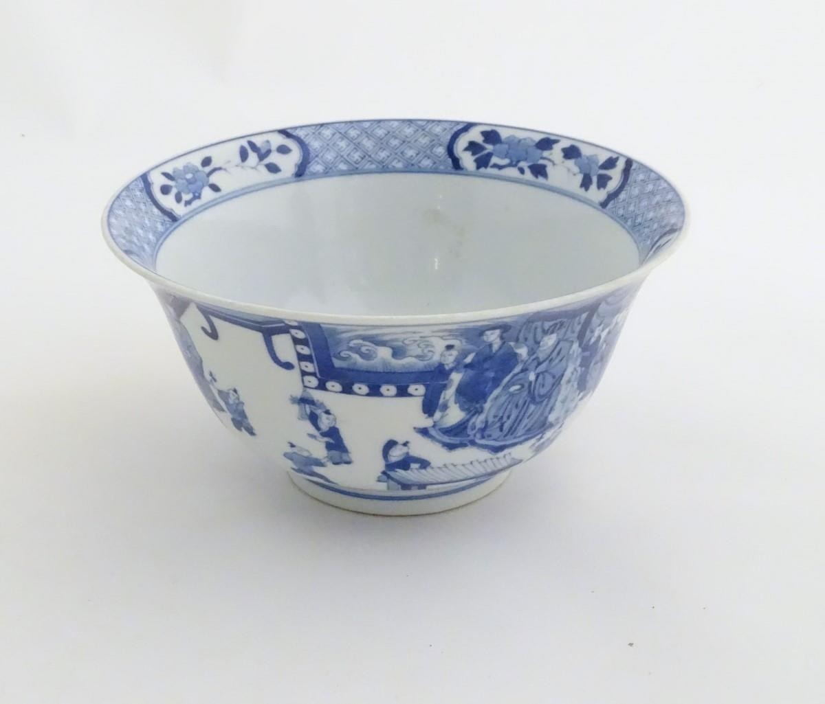 A Chinese blue and white footed bowl with a flared rim, decorated with a scene depicting the - Image 5 of 8