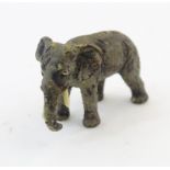 A cold painted bronze model of an elephant. Approx. 1 1/2" long Please Note - we do not make