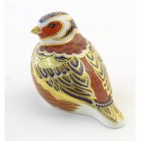 A Royal Crown Derby paperweight modelled as a Chaffinch bird with gilt highlights. Marked under.