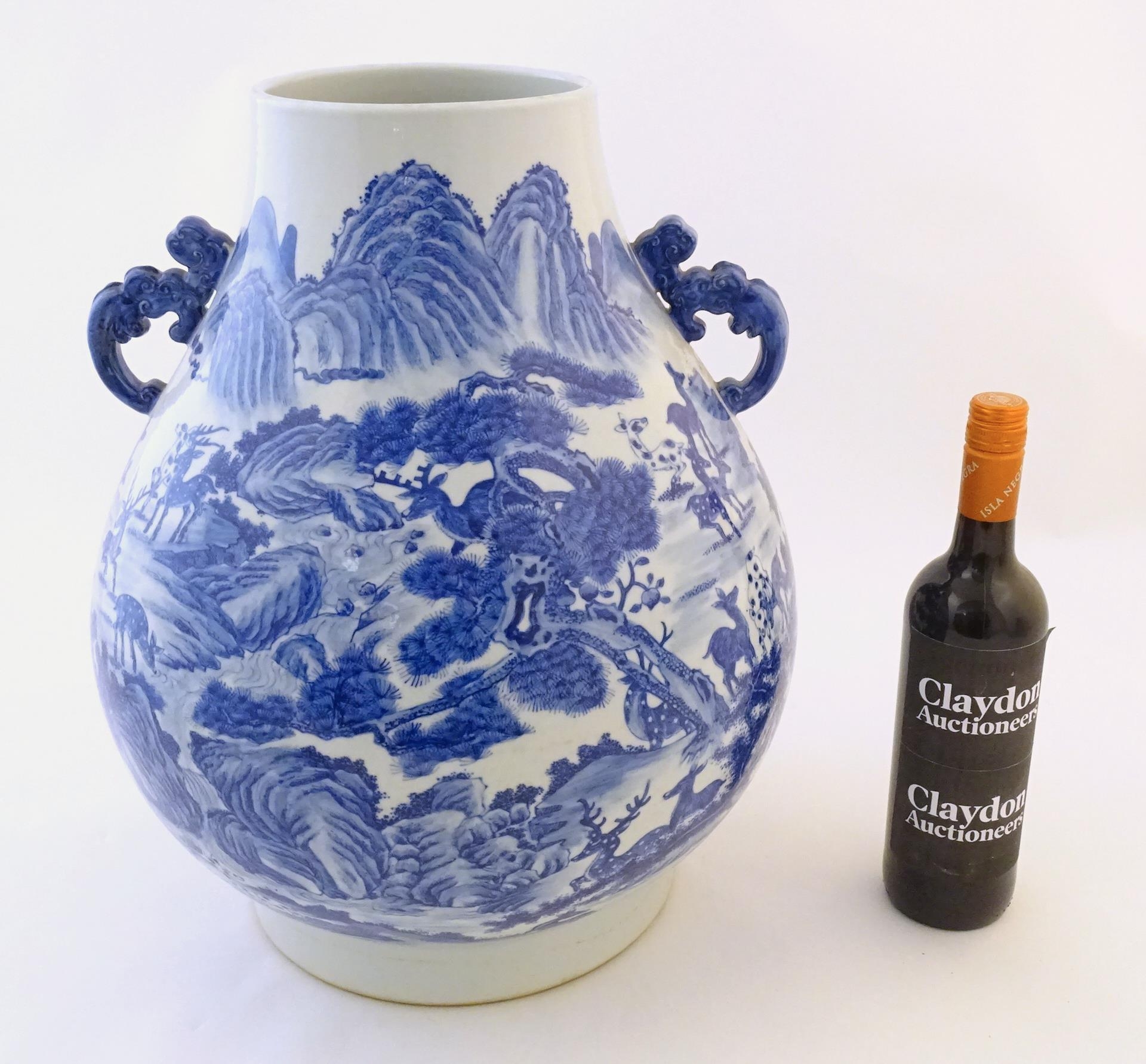 A large Chinese Hu vase with scrolled twin handles, the body decorated in blue and white with the - Image 2 of 9