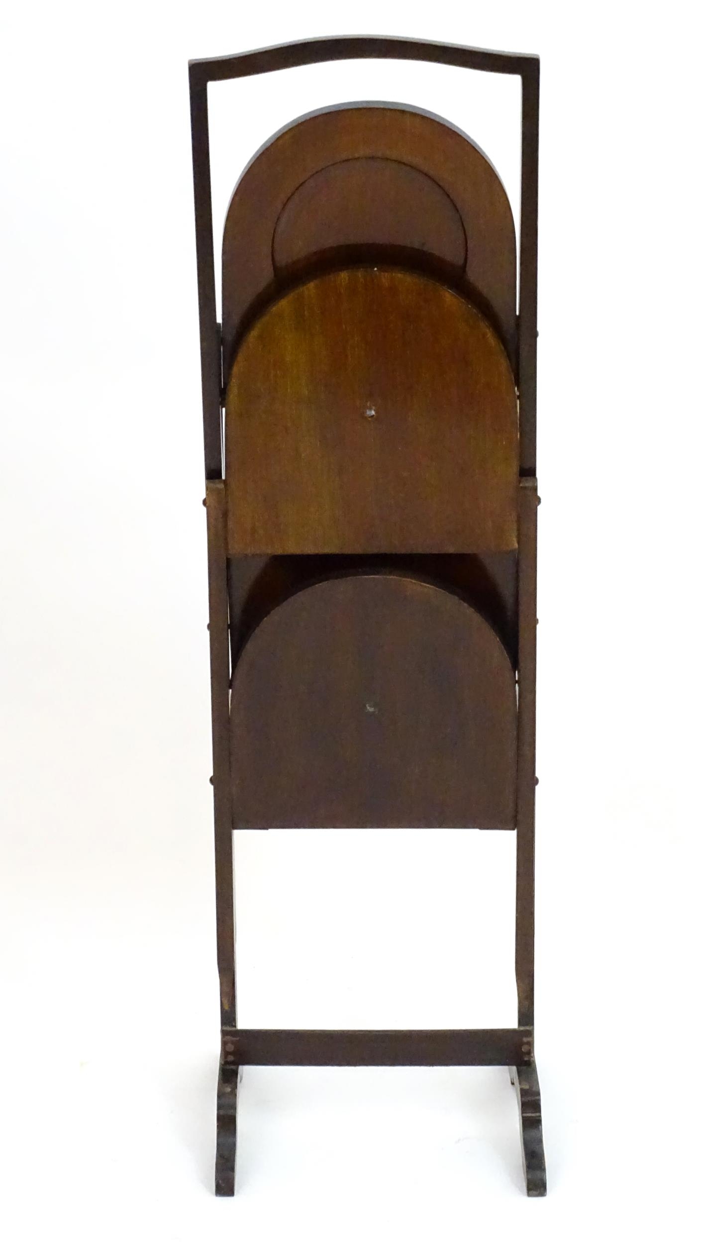 An early 20thC mahogany cake folding cake stand. 34" high. Please Note - we do not make reference to - Image 4 of 4