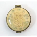An early 20thC rouge pot with owl detail and butterfly clasp. Approx. 1 3/4" Please Note - we do not