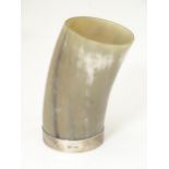 Kitchenalia: a late 20thC bovine horn beaker with silver mount, hallmarked Sheffield 1998 maker