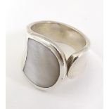 A silver ring with mother of pearl detail. Ring size approx I 1/2" Please Note - we do not make