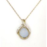 A 9ct gold necklace the pendant set with opal and diamonds. Pendant approx. 3/4" long Please