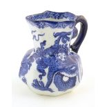 A small Royal Doulton blue and white jug in the Oyama pattern with dragon detail. Marked under.