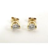 A pair of 9ct gold earrings set with white stone detail. Approx 1/8" long Please Note - we do not