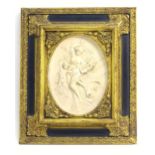 A 20thC cast relief oval plaque depicting a classical scene with a muse holding a lyre and a