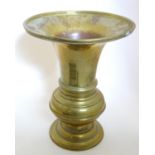 A 19thC Eastern brass spittoon / vase with a flared rim. Approx. 14" high x 11" diameter Please Note