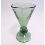 A green glass of conical form with top to stem and fleck detail. Indistinctly signed under. 6 1/4"