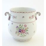 A Booth's silicon china twin handled planter / jardiniere with floral and foliate decoration. Marked