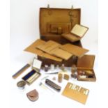 An Early 20thC Gentleman's leather fitted travelling case containing an extensive assortment of