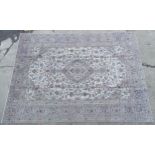 Carpet / Rug : A Kashan carpet, the cream and beige ground with central medallion and floral and