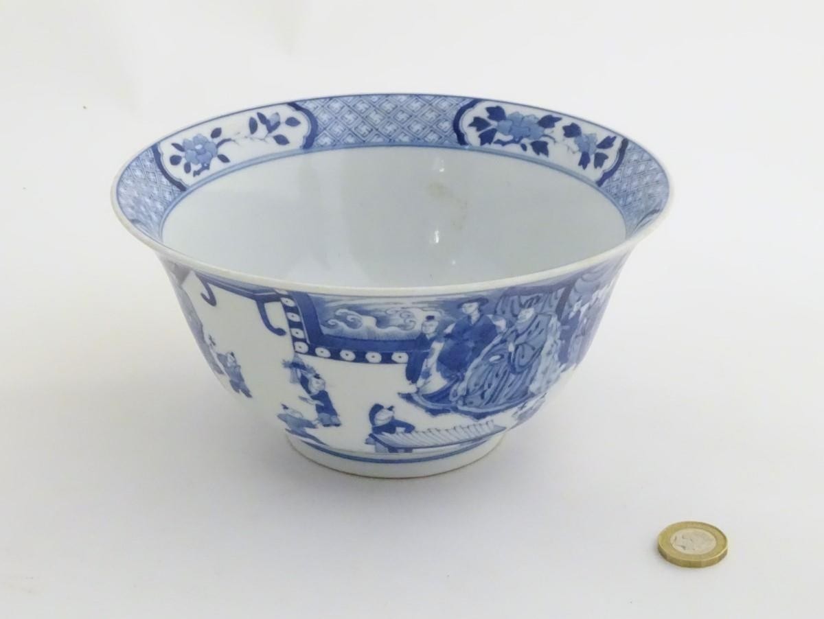 A Chinese blue and white footed bowl with a flared rim, decorated with a scene depicting the - Image 4 of 8