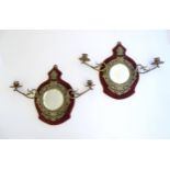 A pair of 19thC girandoles, the brass surround with cast thistle and rose detail, with bevelled
