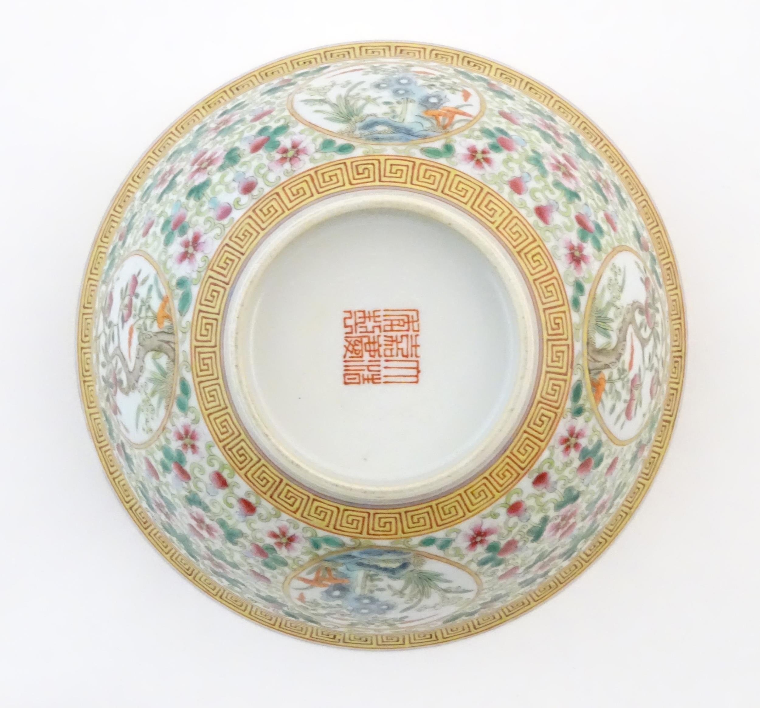 A Chinese famille verte bowl decorated with fruiting trees and landscapes scenes in roundels and - Image 2 of 6