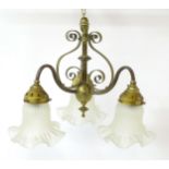 An early 20thC pendant three branch ceiling light , the brass mount with scroll decoration,