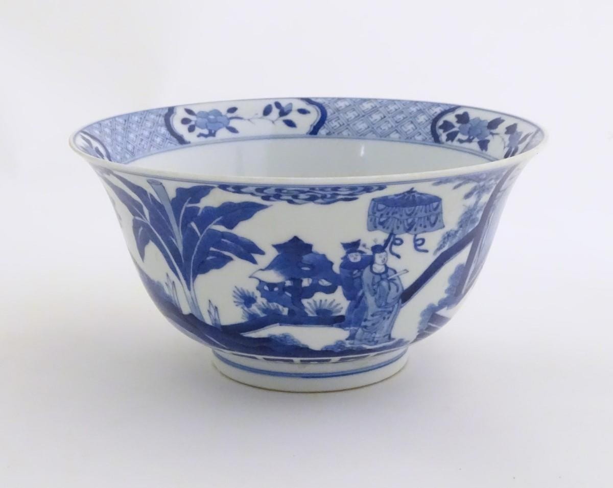 A Chinese blue and white footed bowl with a flared rim, decorated with a scene depicting the - Image 6 of 8