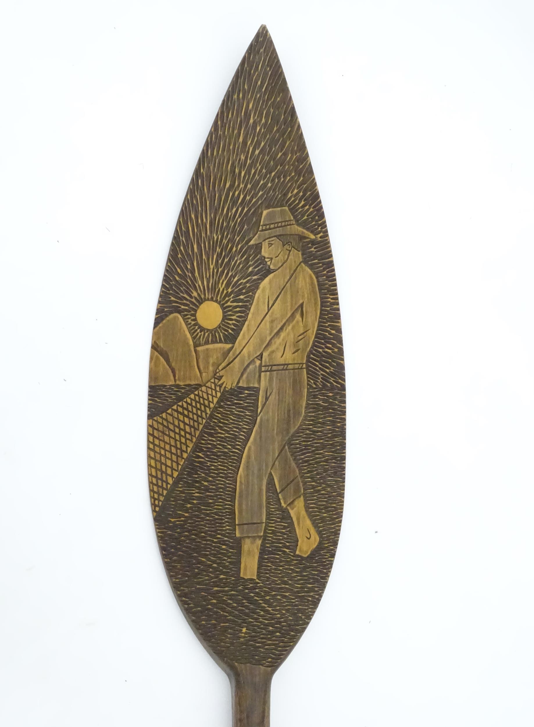 A Brazilian boat oar / paddle with carved decoration a man fishing with a net. Ascribed 'Itatiaia, - Image 4 of 8