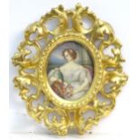 A 19thC oval watercolour portrait miniature depicting a seated maiden with a wreath of flowers and a