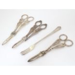 Three assorted silver plate grape shears, together with a pickle fork. The pickle fork approx. 7 1/