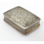 A William IV silver vinaigrette with engraved decoration, opening to reveal a gilded interior and