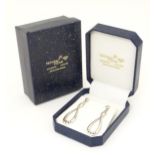 A pair of .925 silver drop earrings, in a box marked Nicholas Wylde of Bath. The earrings approx